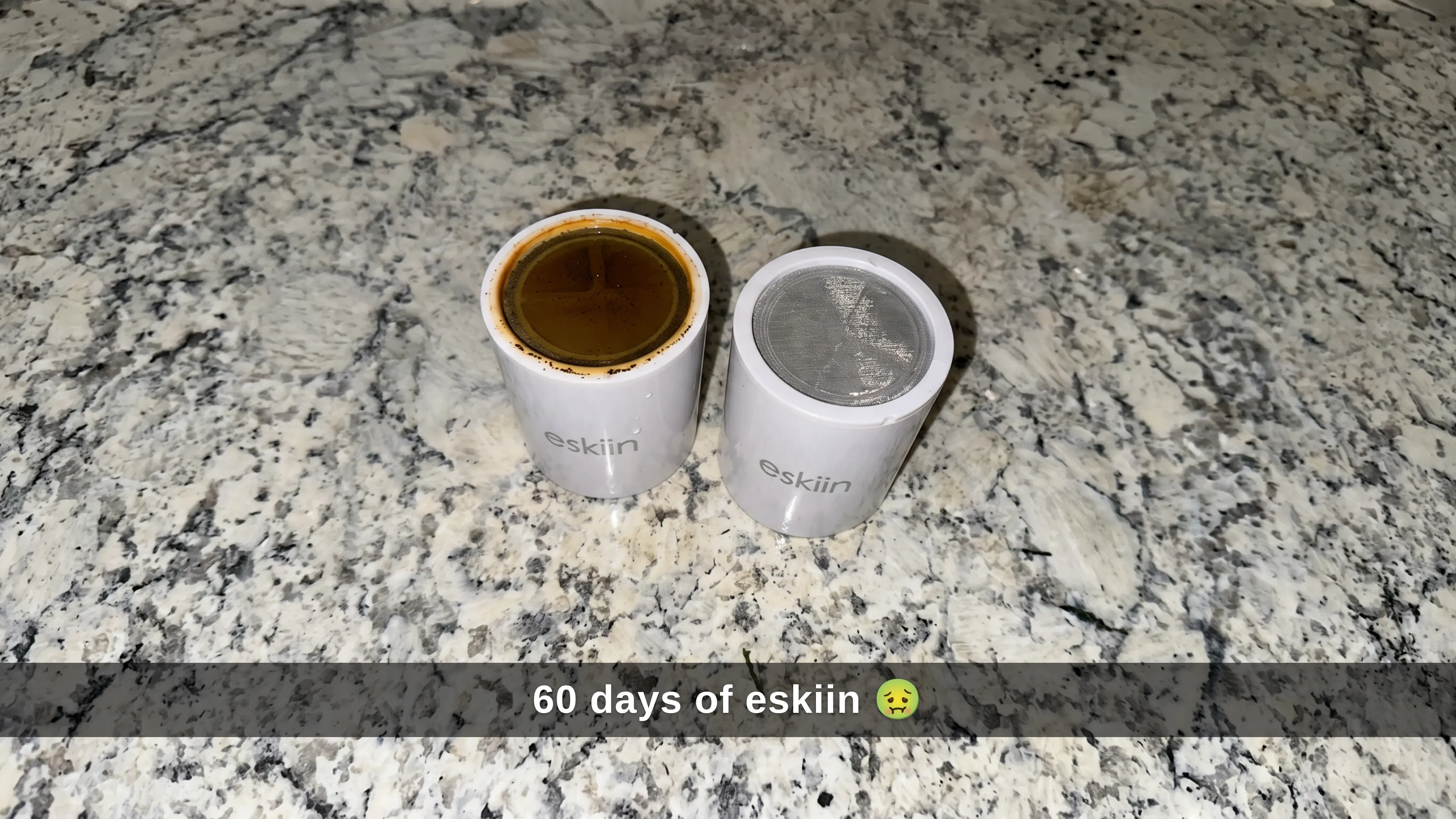 Used eskiin filter dark brown next to clean new filter white — 60 days of eskiin
